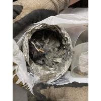 A close view of lint and debris that is clogged inside a dryer vent. 