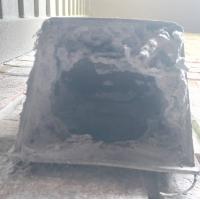 A large amount of lint clogging up a dryer vent. 